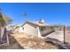 Backyard with covered patio and partial view of the house at 5117 Dancer Way, Las Vegas, NV 89107