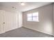 Bright bedroom featuring double closets and grey carpet at 5117 Dancer Way, Las Vegas, NV 89107