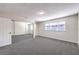 Primary bedroom with mirrored closet doors and grey carpet at 5117 Dancer Way, Las Vegas, NV 89107