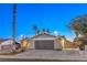 House exterior at dusk with a two-car garage at 5117 Dancer Way, Las Vegas, NV 89107