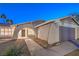 House exterior at night with arched entryway and lighted windows at 5117 Dancer Way, Las Vegas, NV 89107