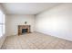 Living room with brick fireplace and tile floors at 5117 Dancer Way, Las Vegas, NV 89107