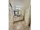 Bathroom with double vanity, bathtub, and tile flooring at 5201 S Torrey Pines Dr # 1244, Las Vegas, NV 89118