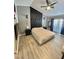 Spacious bedroom with ceiling fan, large bed, and wood-look flooring at 5201 S Torrey Pines Dr # 1244, Las Vegas, NV 89118