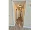 Light and airy hallway with wood-look floors and multiple doors at 5201 S Torrey Pines Dr # 1244, Las Vegas, NV 89118