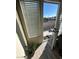 Interior view of a door leading to a balcony, with a plant and wood-look flooring at 5201 S Torrey Pines Dr # 1244, Las Vegas, NV 89118