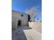 Small gravel backyard with a patio and a view of a tree and block wall at 5933 Vegas Dr, Las Vegas, NV 89108