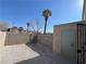 Small gravel backyard with storage shed and tall trees at 5933 Vegas Dr, Las Vegas, NV 89108