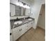 Modern bathroom with double vanity and gray counters at 5933 Vegas Dr, Las Vegas, NV 89108