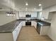 Modern kitchen with white cabinets, gray countertops, and stainless steel appliances at 5933 Vegas Dr, Las Vegas, NV 89108