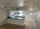 Modern kitchen with an island and white cabinets at 5933 Vegas Dr, Las Vegas, NV 89108