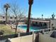 Community pool with surrounding grassy area at 5933 Vegas Dr, Las Vegas, NV 89108