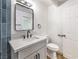 Stylish bathroom featuring a modern vanity with matte black fixtures and blue accent tile at 701 N Yale St, Las Vegas, NV 89107