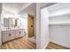 Modern bathroom with double vanity, a tile shower, and a walk-in closet with ample storage at 701 N Yale St, Las Vegas, NV 89107