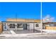 Exterior front view showcasing the home's well-maintained facade and carport at 701 N Yale St, Las Vegas, NV 89107