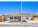 Single-story home boasting a modern design with a carport at 701 N Yale St, Las Vegas, NV 89107