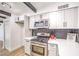 Stainless steel oven against white cabinets with black tile backsplash and wood-look floors at 701 N Yale St, Las Vegas, NV 89107