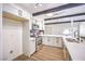 Updated kitchen featuring black accents, white cabinets, stainless appliances, and island sink at 701 N Yale St, Las Vegas, NV 89107