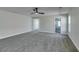 Spacious bedroom with plush carpet and ceiling fan at 7024 Bluebird Wing St, North Las Vegas, NV 89084