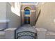 Front entry with double doors and decorative iron gate at 7024 Bluebird Wing St, North Las Vegas, NV 89084