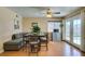 Casual dining area with gray sectional sofa and wood floors at 7037 Pleasant View Ave, Las Vegas, NV 89147