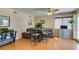 Cozy dining area with wood floors and gray furniture at 7037 Pleasant View Ave, Las Vegas, NV 89147