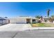 Single story home with attached garage and landscaped lawn at 7037 Pleasant View Ave, Las Vegas, NV 89147