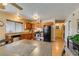 Bright kitchen with stainless steel appliances and wood cabinets at 7037 Pleasant View Ave, Las Vegas, NV 89147