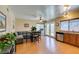 Open concept kitchen and dining area with wood floors at 7037 Pleasant View Ave, Las Vegas, NV 89147