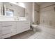 Modern bathroom with white vanity and bathtub at 7167 S Durango Dr # 203, Las Vegas, NV 89113