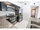 Modern kitchen with stainless steel appliances and granite countertops at 7167 S Durango Dr # 203, Las Vegas, NV 89113