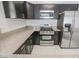 Modern kitchen with stainless steel appliances and granite countertops at 7167 S Durango Dr # 203, Las Vegas, NV 89113