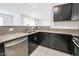 Modern kitchen with stainless steel appliances and granite countertops at 7167 S Durango Dr # 203, Las Vegas, NV 89113