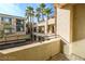 View from patio showing complex courtyard and palm trees at 7167 S Durango Dr # 203, Las Vegas, NV 89113