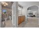 Well-appointed bathroom showcasing a vanity, and views of a beautifully designed bedroom at 7450 Via Olivero Ave, Las Vegas, NV 89117