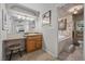 Well-appointed bathroom showcasing a vanity, soaking tub and decorative tile surround at 7450 Via Olivero Ave, Las Vegas, NV 89117