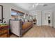 Bedroom showcasing daybed, wood floors, mirrored closet, and neutral paint at 7450 Via Olivero Ave, Las Vegas, NV 89117