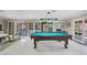 Billiard room with pool table and access to the outdoor patio at 7450 Via Olivero Ave, Las Vegas, NV 89117