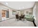 Dining area with neutral paint, modern chairs, and a table set for a meal at 7450 Via Olivero Ave, Las Vegas, NV 89117