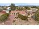 Beautiful single-story residence featuring a terra cotta roof, desert landscaping, and a private gated entrance at 7450 Via Olivero Ave, Las Vegas, NV 89117