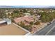 Single-story home showcasing a spacious yard and an elegant terra cotta-tiled roof in a desirable neighborhood at 7450 Via Olivero Ave, Las Vegas, NV 89117