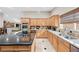 Kitchen with a view to a second eating area and the living room at 7450 Via Olivero Ave, Las Vegas, NV 89117