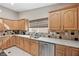 Kitchen featuring stainless steel appliances, sink, and plenty of counter space at 7450 Via Olivero Ave, Las Vegas, NV 89117