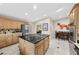 Well-lit kitchen featuring marble floors, stainless steel appliances, and island cooktop at 7450 Via Olivero Ave, Las Vegas, NV 89117