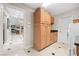 Spacious laundry room featuring built in storage cabinetry and tile flooring at 7450 Via Olivero Ave, Las Vegas, NV 89117