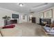 Stylish main bedroom featuring a fireplace, TV, and comfortable seating for relaxation at 7450 Via Olivero Ave, Las Vegas, NV 89117