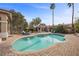 Inviting backyard pool surrounded by brick pavers, mature landscaping, and comfortable lounge chairs at 7450 Via Olivero Ave, Las Vegas, NV 89117