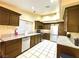 Kitchen boasts dark wood cabinets and granite countertops at 7874 Clearwood Ave, Las Vegas, NV 89123