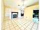 Spacious living room with tile floors and a fireplace at 7874 Clearwood Ave, Las Vegas, NV 89123