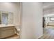 Small bathroom with toilet, sink and vanity, and view of kitchen at 7923 Canoe Ln, Las Vegas, NV 89145